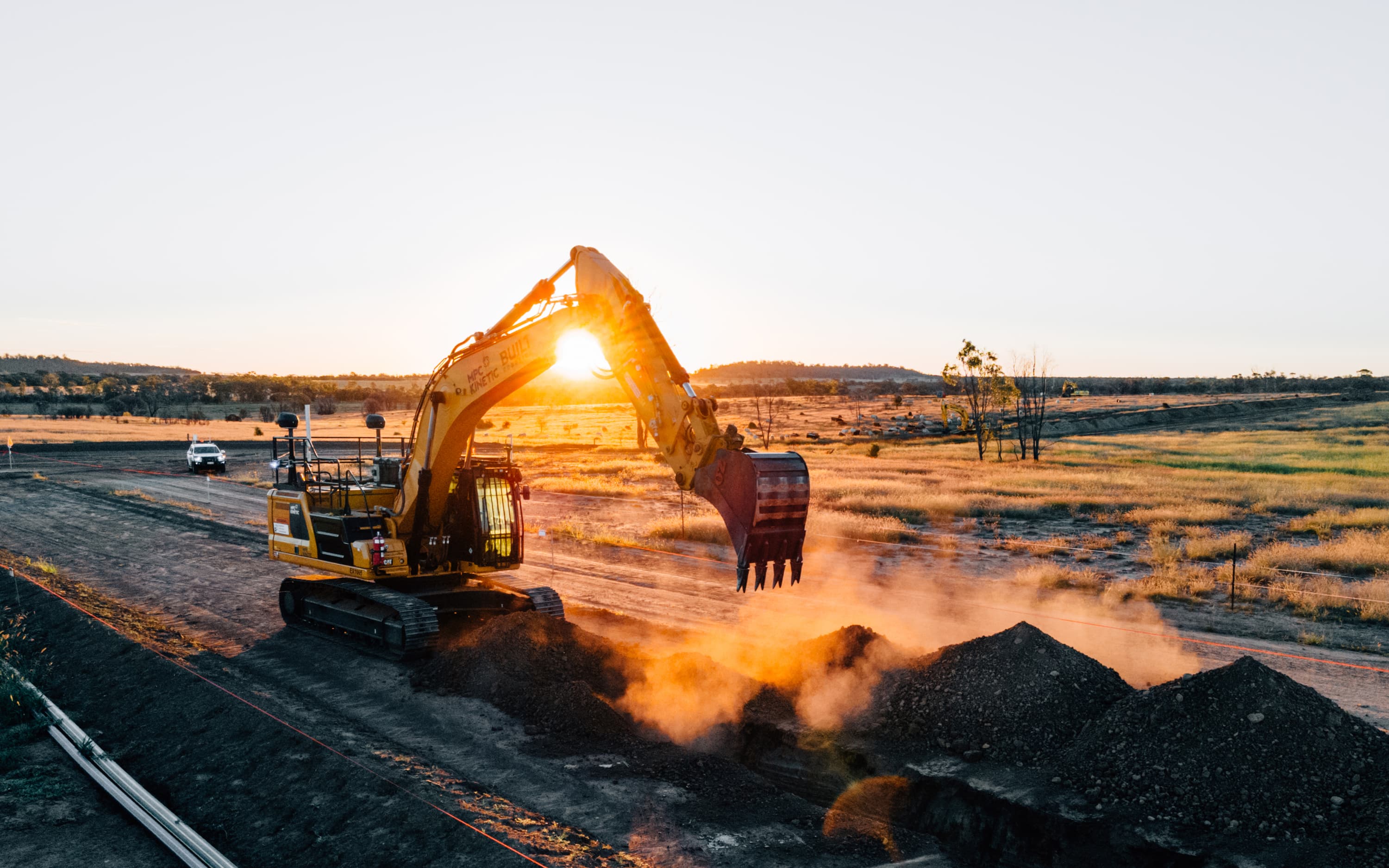 Exosystem digging trench with sunset