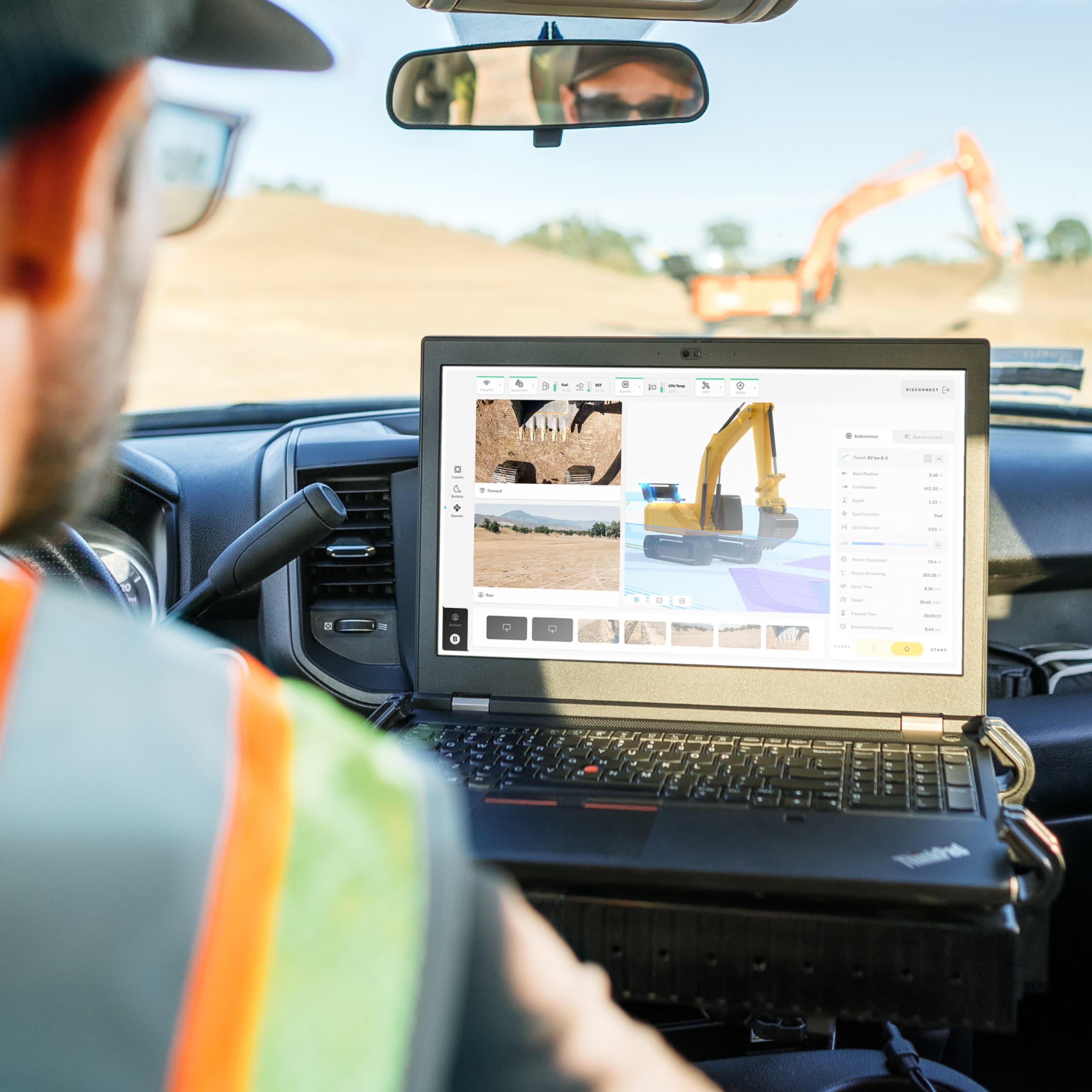 A Robotic Equipment Operator (REO) Monitoring Robot Trenching Progress inside a Truck
