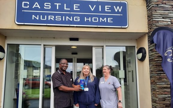 Alzheimer's Society Isle of Man Collecting Monies Raised from Castle View Nursing Home in Peel