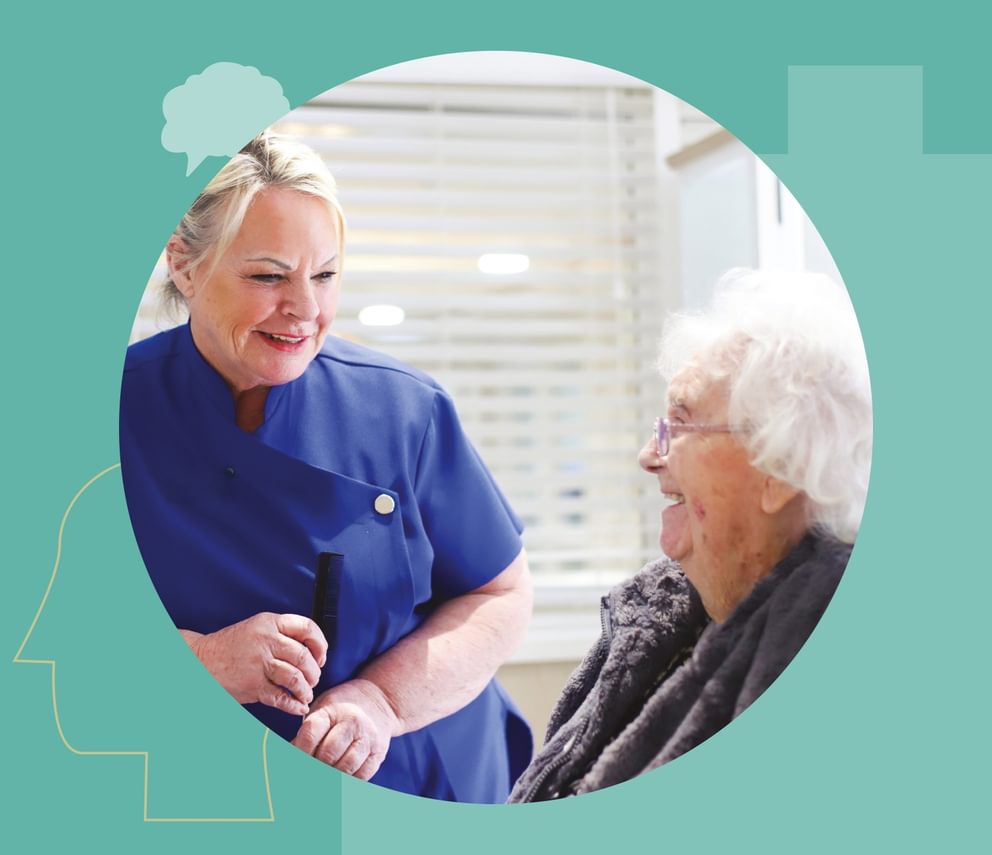 Dementia care specialist talking with a care home resident.