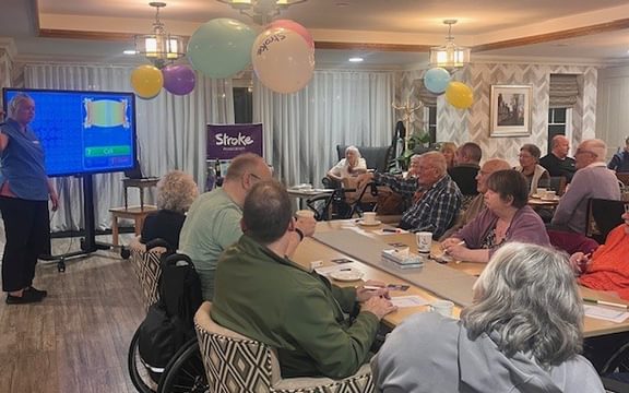 Care home residents and visitors play bingo to raise funds for Stroke Association