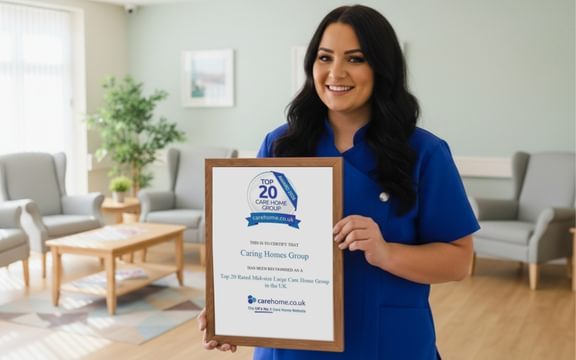 Caring Homes wellbeing team member holds Top 20 Care Home UK 2026 certificate