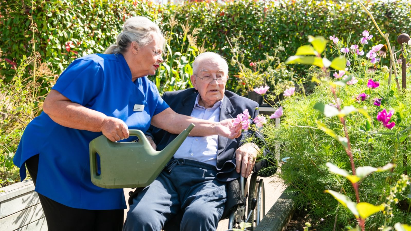 Care Home Carer with resident in the garden