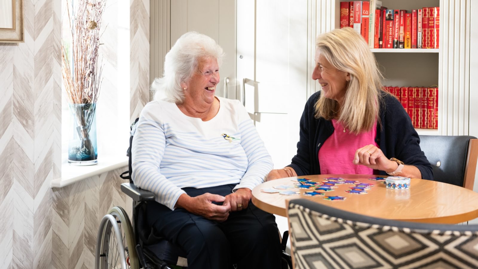 Blenheim Court Care Home Resident playing scrabble with a carer