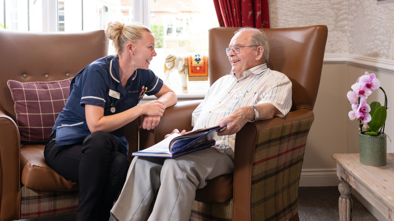 Blenheim Court Care Home resident talking to a nurse
