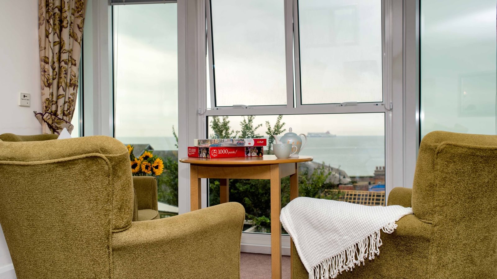 Cotman House Care Home lounge with view over the sea in Felixstowe