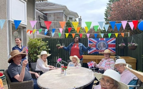 Hawkhill House residents and team enjoying the Platinum Jubilee Party