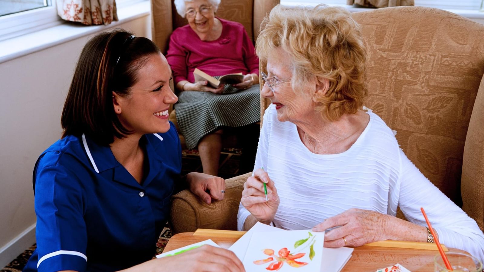 Latham Lodge Care Home Nurse talking to a resident in a care home