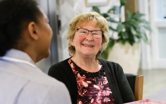 Carer with resident at Mellish House care Home in Sudbury, Suffolk