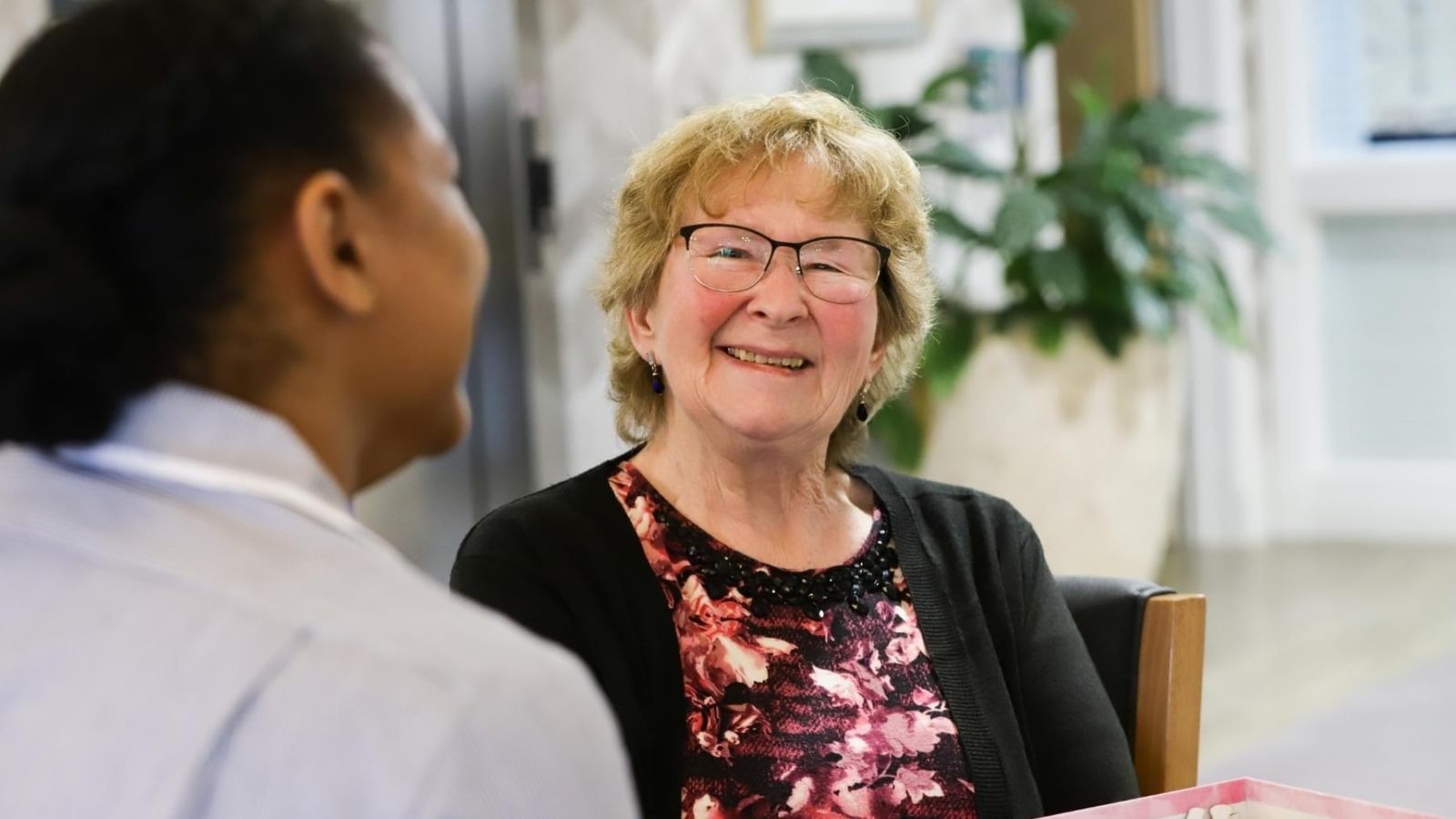 Carer with resident at Mellish Care Home specialising in dementia and palliative care in Suffolk