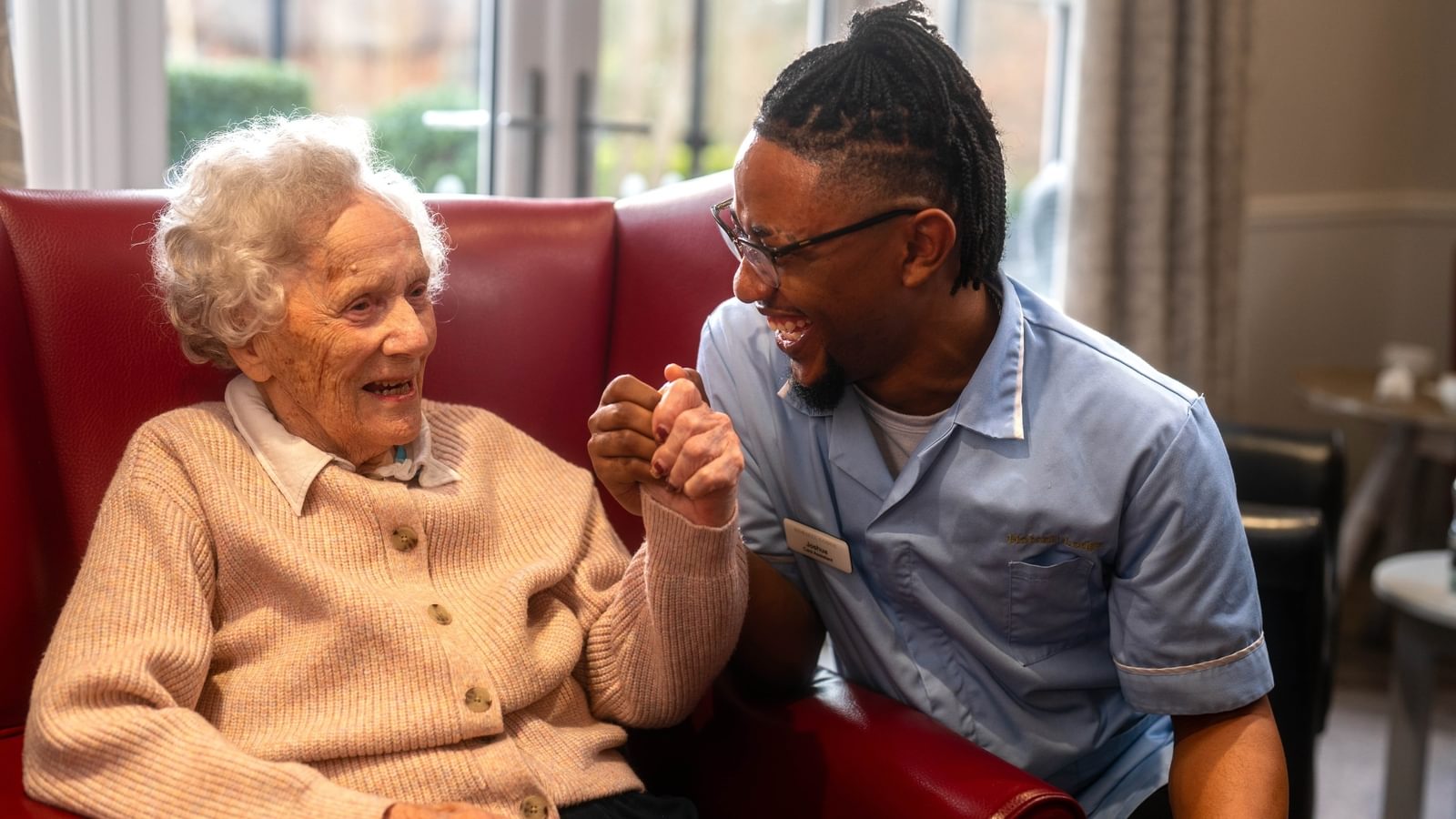 Resident with a carer at Mellish Care Home specialising in dementia and palliative care in Suffolk