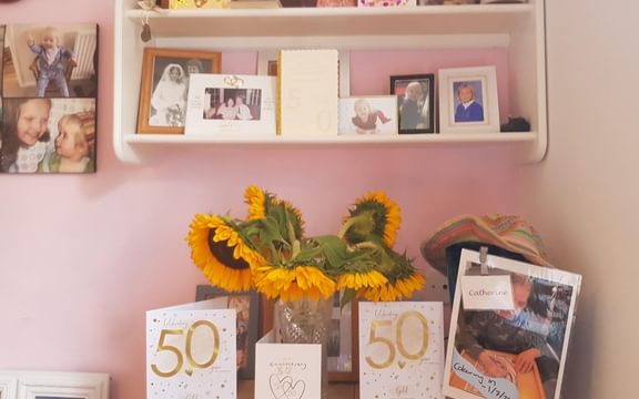 50th anniversary cards and sunflowers in a vase