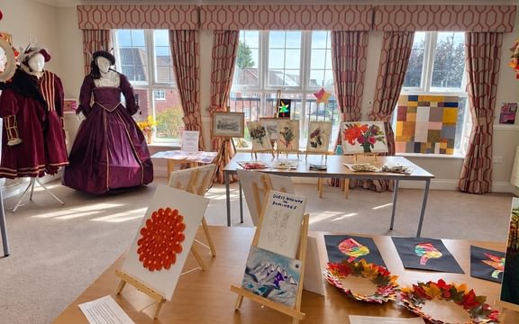 Room full of art exhibits created by care home residents