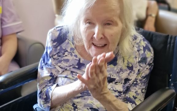 Resident clapping to music