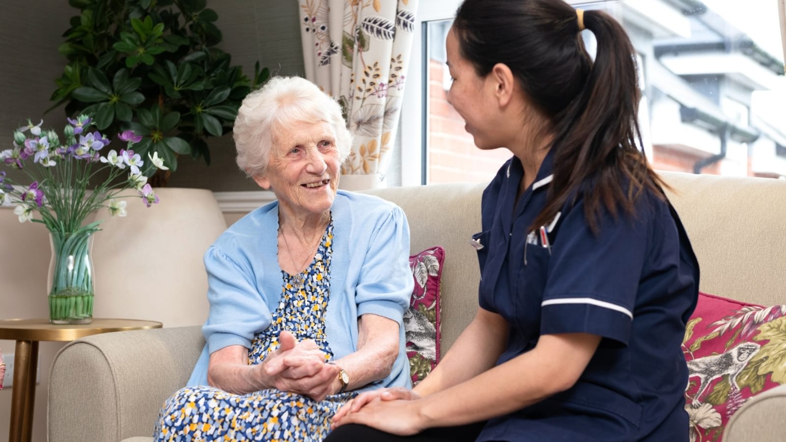 The Orchard Nursing Home in St Albans, Hertfordshire Resident sitting with a nurse