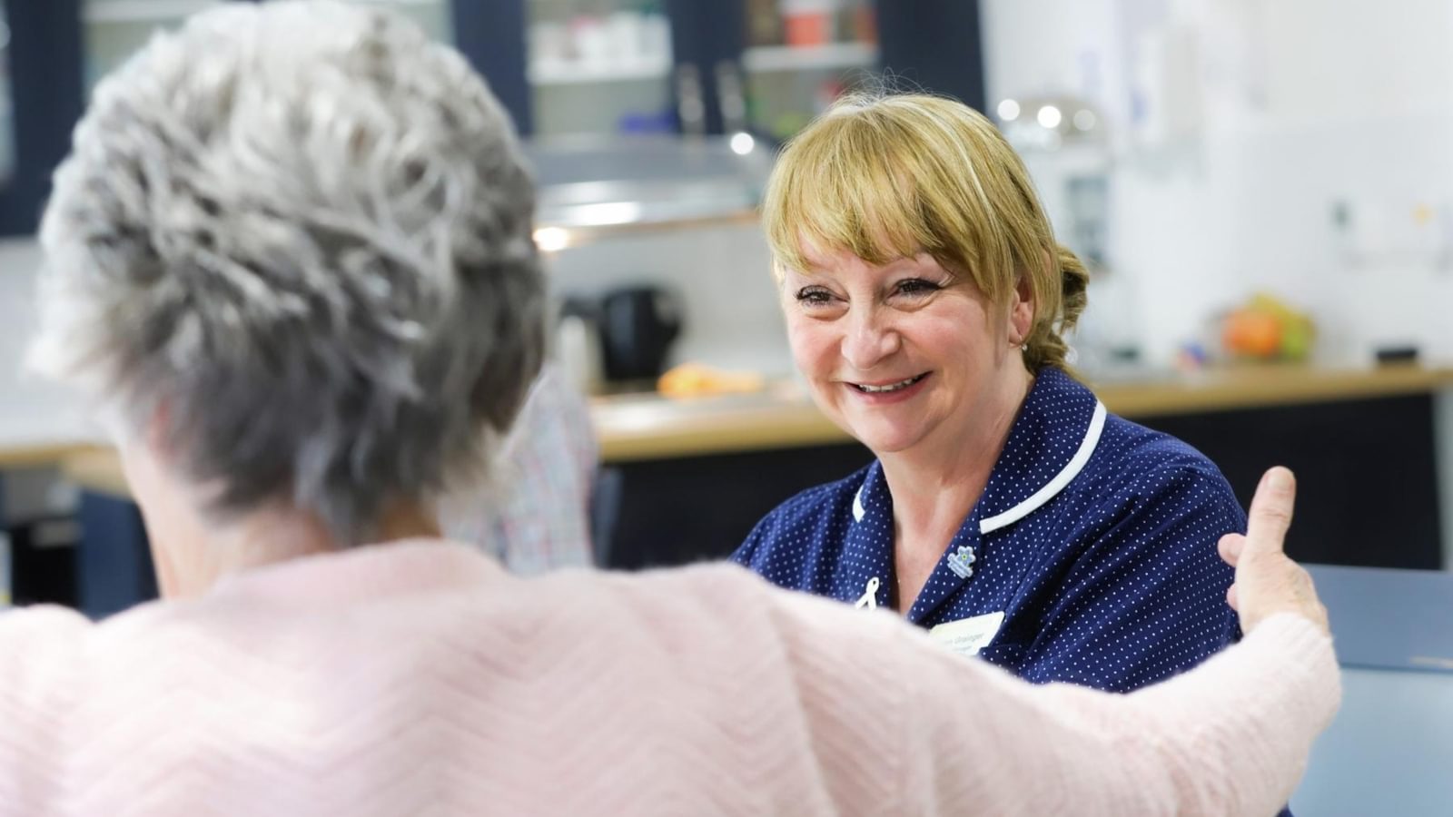 The Orchard Nursing Home in St Albans, Resident talking to a nurse