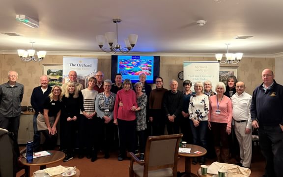 Group from local community joins residents at a care home for a dementia awareness workshop