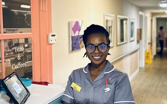 Close up shot of Care Home Assistant Practitioner in corridor