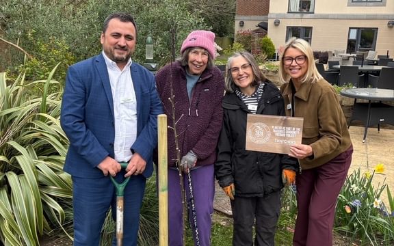 Care Home team plant an orchard with Thatchers community project