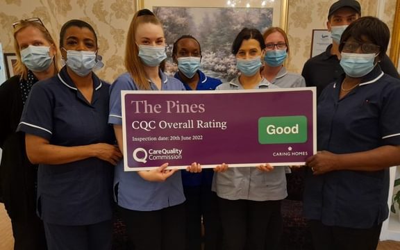 The Pines Care Home Team celebrate Good CQC