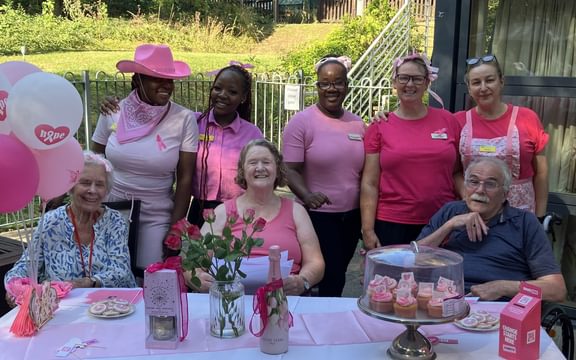 Care home residents judge competition for best pink outfit in aid of breast cancer charity