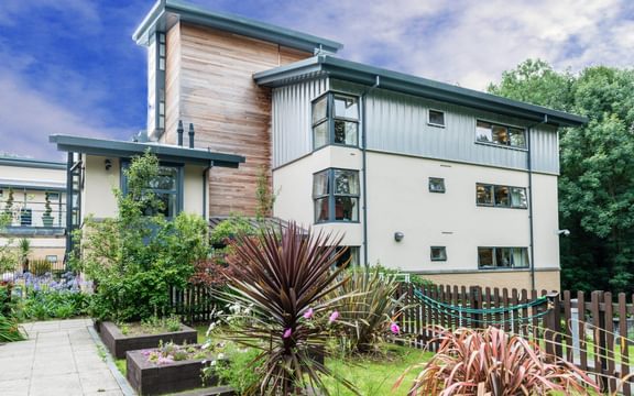 Exterior and grounds of Whittington House care home in Cheltenham
