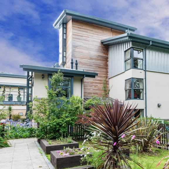 Exterior and grounds of Whittington House care home in Cheltenham