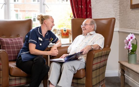 Nurse and resident smiling