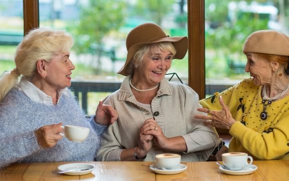 Residents needing stroke rehabilitation and enjoying a friendship cafe at a Caring Homes care home