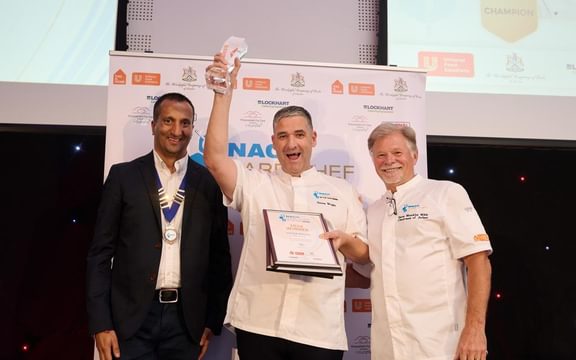 NACC Care Chef of the Year 2026 winner Steven Wright with NACC National Chair Neel Radia left and Head Judge Steve Munkley