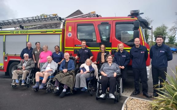 Caring residents and local firefighters at Blenheim Court in Hampshire