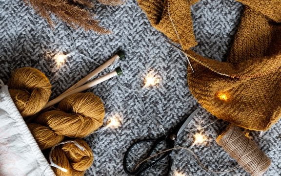 Brown yarn on grey textile.