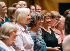 Photograph of women smiling during a CBSO Chorus rehearsal