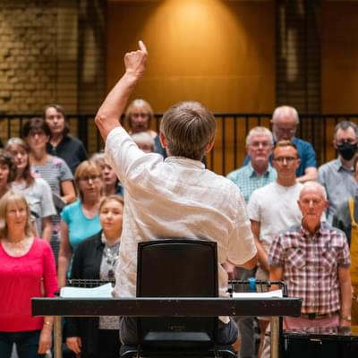 Photograph of Simon Halsey conducting the Chorus in a rehearsal at CBSO Centre