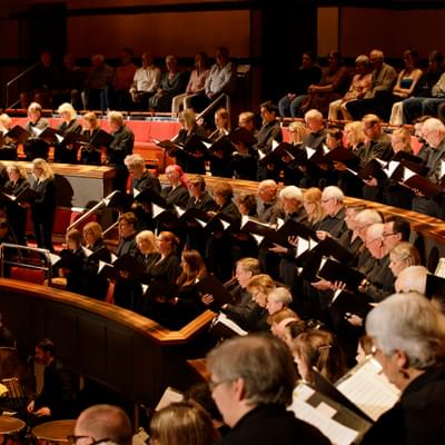 Photograph of the CBSO Chorus in the choir stalls of Symphony Hall.