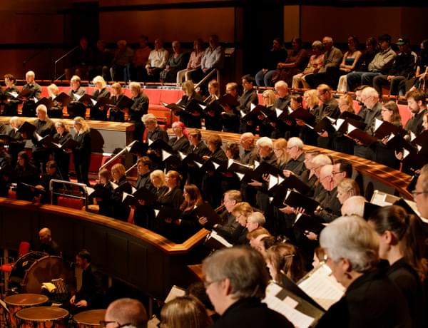 Photograph of the CBSO Chorus in the choir stalls of Symphony Hall.