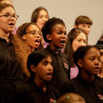 Photograph of the Children's Chorus singing.