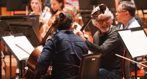 Photograph of Eduardo Vassallo laughing with the CBSO cello section