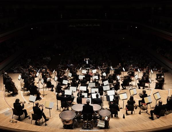Photograph of the orchestra rehearsing with Kazuki Yamada on-stage at Symphony Hall