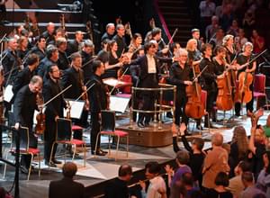Photograph of Kazuki Yamada and the orchestra receiving a standing ovation at the Royal Albert Hall