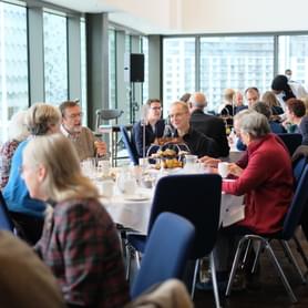 Photograph of CBSO Members and musicians enjoying an afternoon tea at Symphony Hall