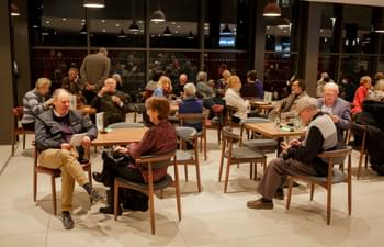 People sit talking in the B:Eats café at Symphony Hall