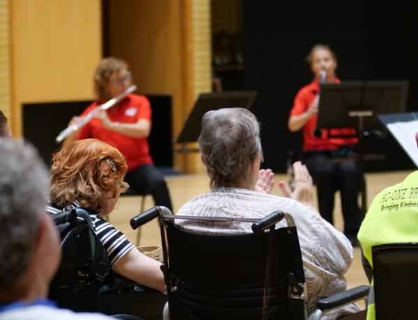 Photograph of wheelchair users watching a Cuppa Concerts performance at CBSO Centre
