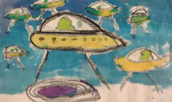 Photograph of a child's drawing of alien spaceships