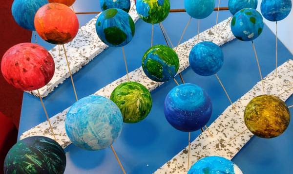 Children's sculptures of different planets