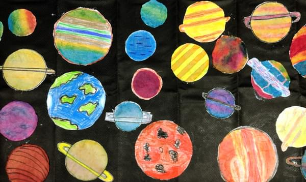 Child's drawing of planets in space