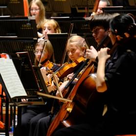 Photograph of a young woman playing the viola in the CBSO Youth Orchestra