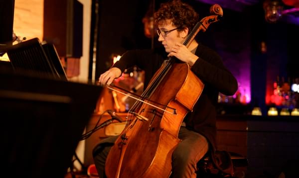 Photograph of Arthur Boutillier playing the cello at Hockley Social Club