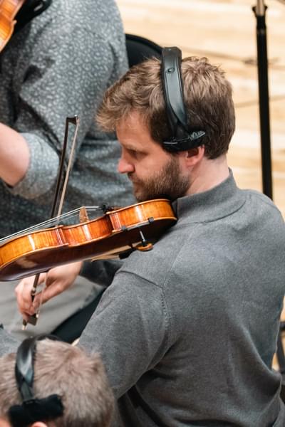 Photograph of Moritz Pfister playing the violin during a recording session at CBSO Centre