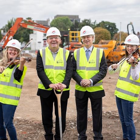 An image of Stephen and members of staff from Shireland CBSO Academy on the building site